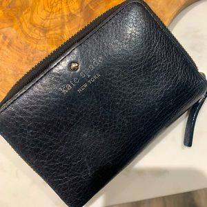 Black Kate Spade Bifold wallet with zipper compartment